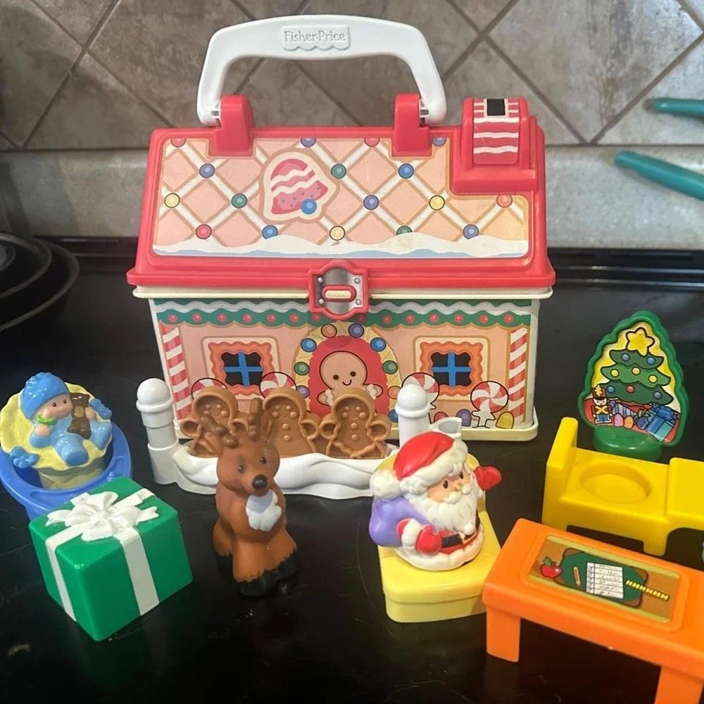 Vintage Fisher Price Christmas playset with Santa, reindeer, and gingerbread